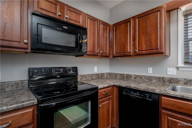 kitchen with black appliances and brown cabinets