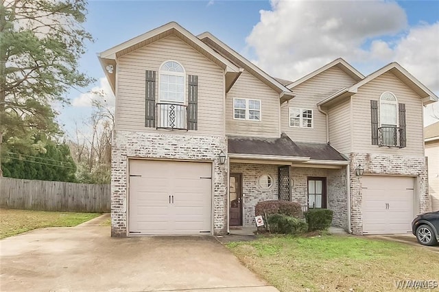 view of front of home featuring a front yard, fence, concrete driveway, a garage, and brick siding