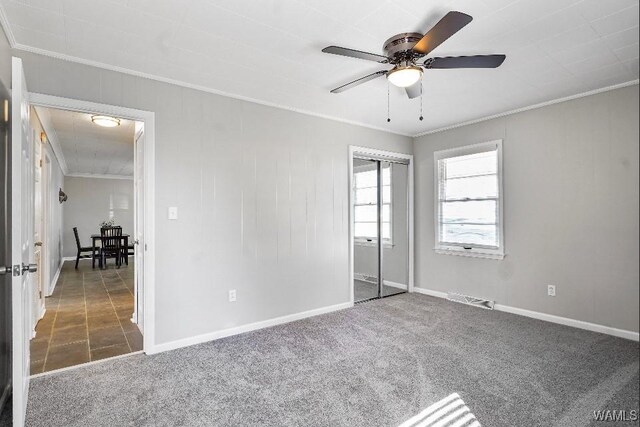 65 Wooley Rd, Brent, AL 35034 - unfurnished bedroom featuring ornamental molding, carpet floors, baseboards, a closet, and ceiling fan