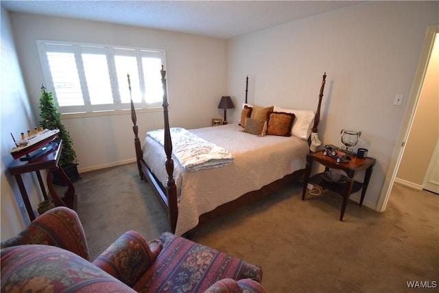 bedroom featuring dark colored carpet