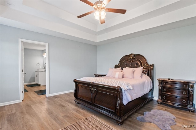 320 Rob Lee St, Moundville, AL 35474 - bedroom with wood finished floors, a raised ceiling, ceiling fan, and ensuite bathroom
