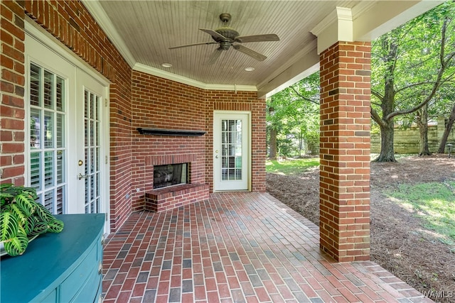 view of patio featuring ceiling fan, french doors, and an outdoor brick fireplace