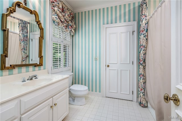 bathroom featuring toilet, vanity, tile patterned floors, and ornamental molding