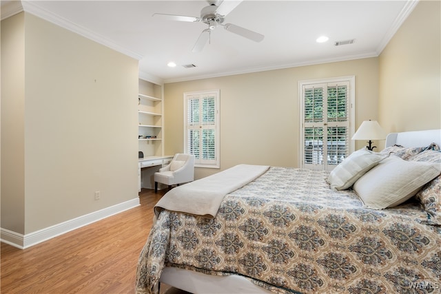 bedroom featuring hardwood / wood-style flooring, ceiling fan, and crown molding