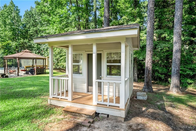 view of outdoor structure featuring a gazebo and a lawn