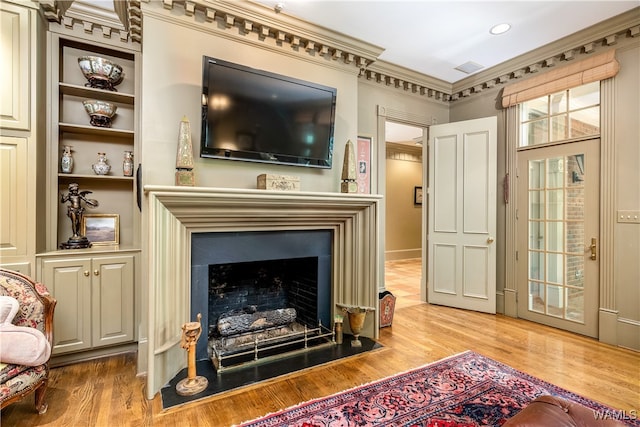 interior space with crown molding and hardwood / wood-style floors