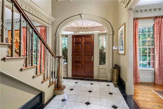 foyer entrance with light hardwood / wood-style floors