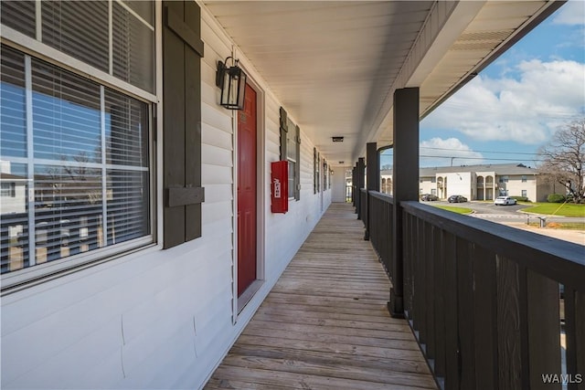 exterior space featuring covered porch and a residential view