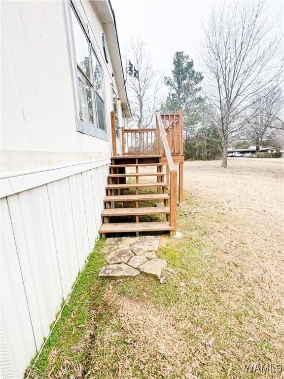 view of yard featuring stairway and a wooden deck