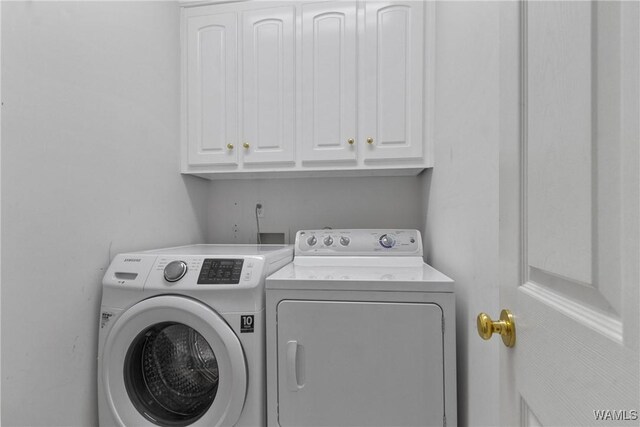 839 Seven Oaks Pl, Tuscaloosa, AL 35406 - laundry room featuring cabinet space and separate washer and dryer