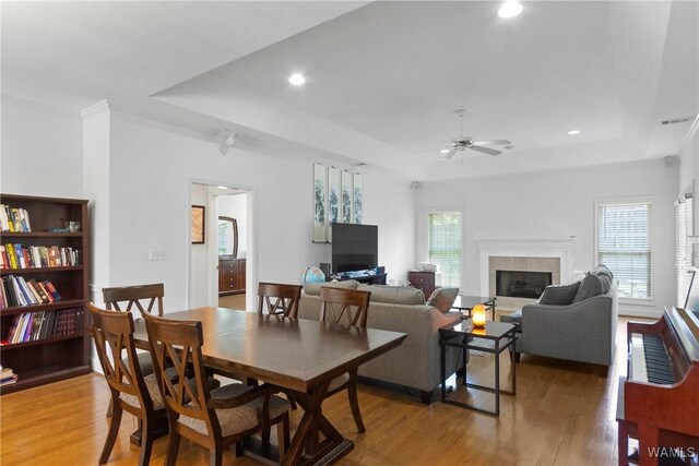 839 Seven Oaks Pl, Tuscaloosa, AL 35406 - dining room featuring a raised ceiling, plenty of natural light, a ceiling fan, light wood finished floors, and recessed lighting