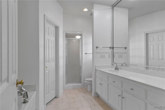 839 Seven Oaks Pl, Tuscaloosa, AL 35406 - bathroom with vanity, a shower stall, tile patterned flooring, and a garden tub