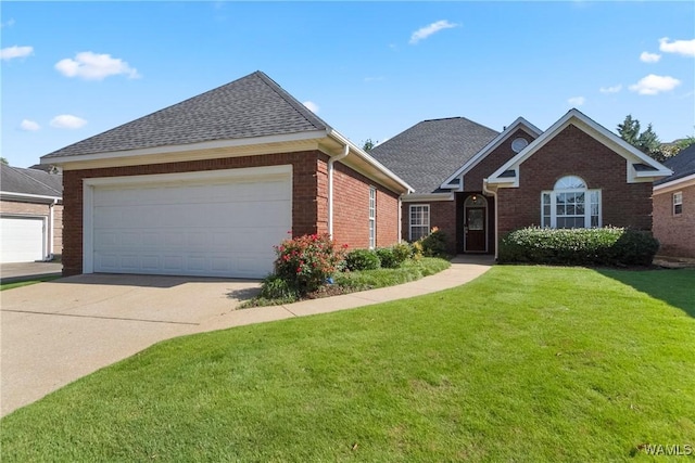 839 Seven Oaks Pl, Tuscaloosa, AL 35406 - traditional-style house with brick siding, a front lawn, driveway, a shingled roof, and an attached garage