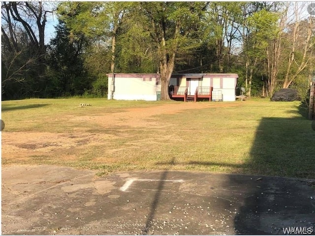 view of yard featuring a deck