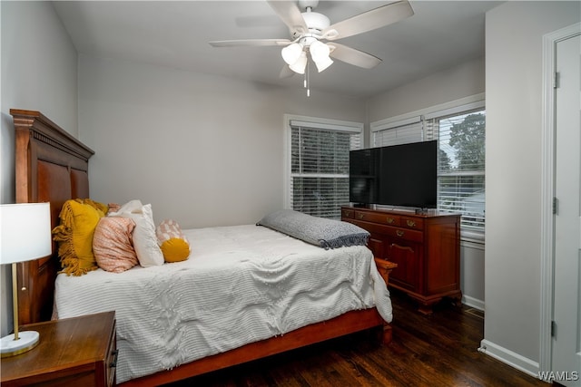 bedroom featuring ceiling fan and dark hardwood / wood-style flooring