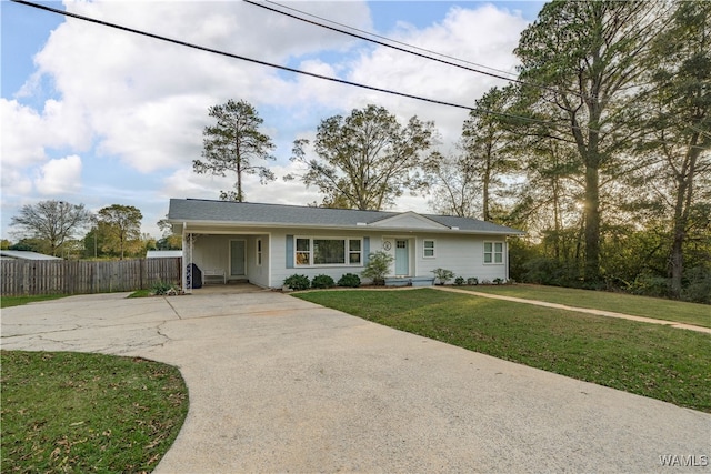 ranch-style home featuring a front yard