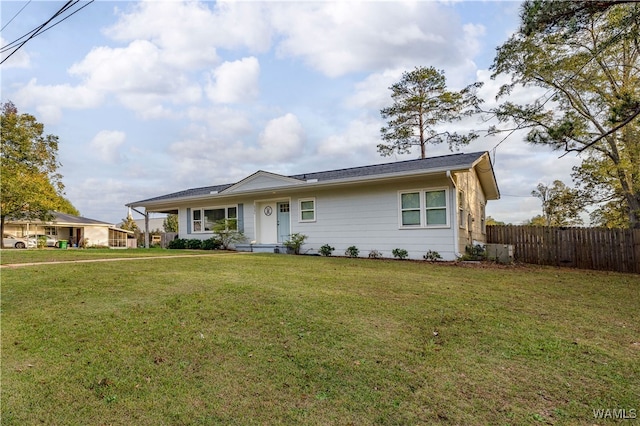 ranch-style house with a front lawn