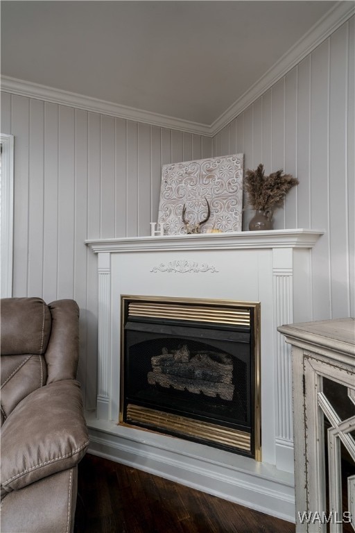 interior details featuring wooden walls, hardwood / wood-style floors, and ornamental molding