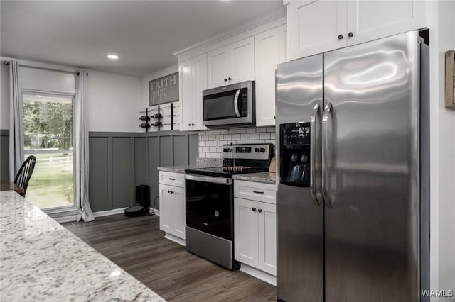 15120 Lakeland Forest Dr, Northport, AL 35475 - kitchen with stainless steel appliances, white cabinets, dark wood-type flooring, decorative backsplash, and recessed lighting
