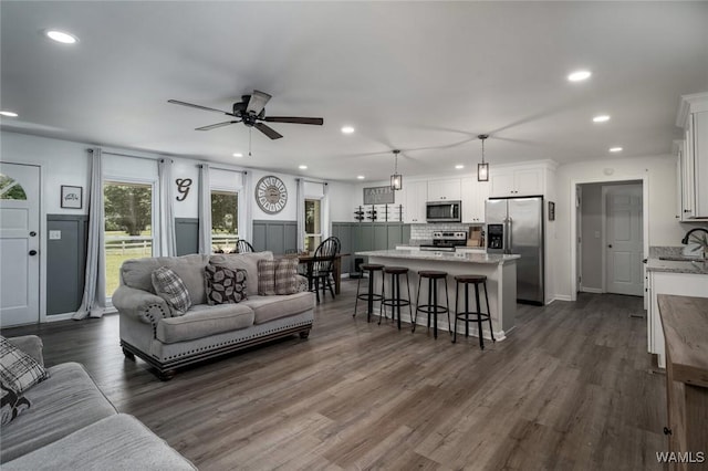 15120 Lakeland Forest Dr, Northport, AL 35475 - living room featuring recessed lighting, ceiling fan, dark wood-type flooring, and baseboards