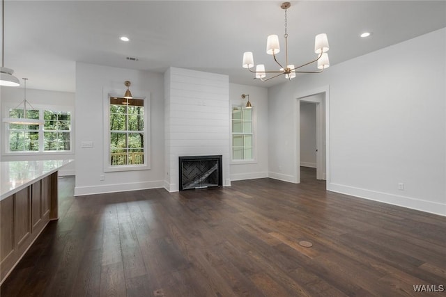 14817 Highpoint Cv, Northport, AL 35475 - unfurnished living room featuring a chandelier, dark wood finished floors, a fireplace, and recessed lighting