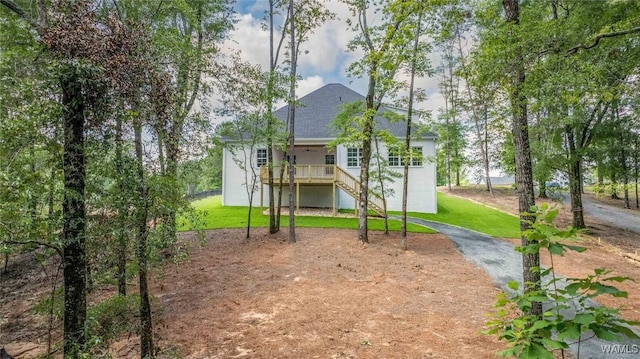 14817 Highpoint Cv, Northport, AL 35475 - rear view of property with stairs, a lawn, roof with shingles, and stucco siding