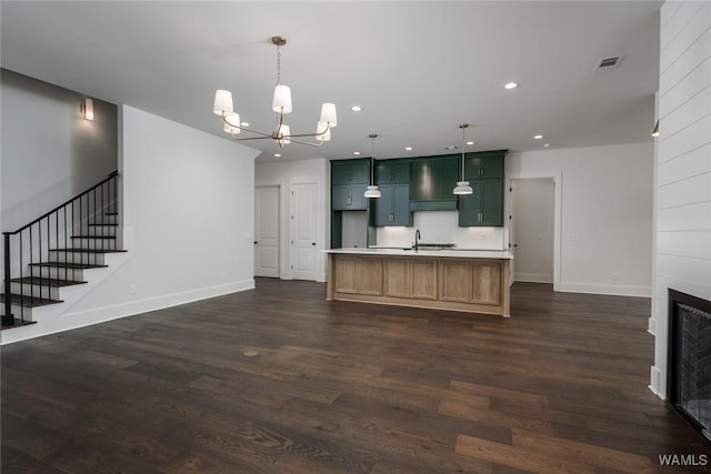 14817 Highpoint Cv, Northport, AL 35475 - kitchen with a chandelier, dark wood finished floors, recessed lighting, light countertops, and a kitchen island with sink
