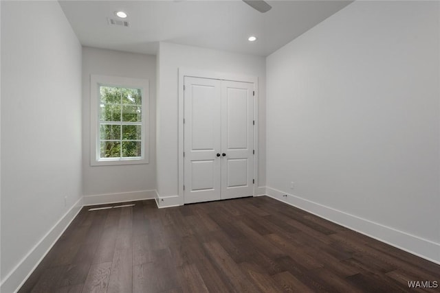 14817 Highpoint Cv, Northport, AL 35475 - unfurnished bedroom with dark wood-style flooring, recessed lighting, ceiling fan, and a closet