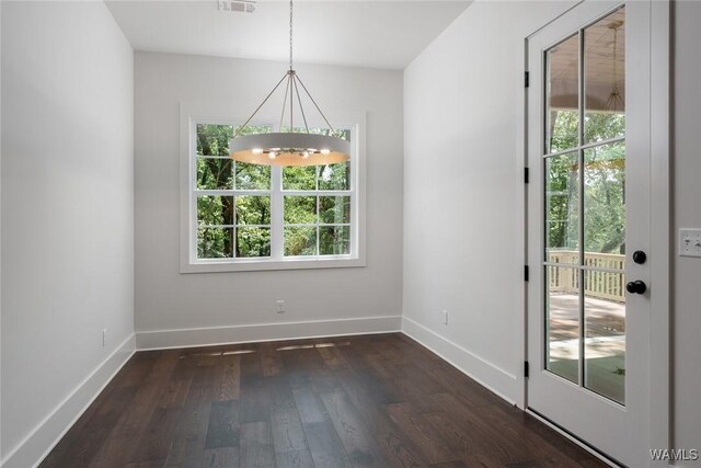 14817 Highpoint Cv, Northport, AL 35475 - unfurnished dining area with a chandelier and dark wood-type flooring