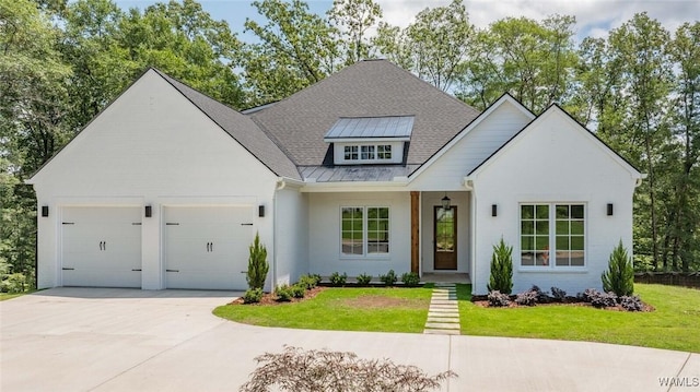 14817 Highpoint Cv, Northport, AL 35475 - modern farmhouse style home with an attached garage, concrete driveway, a front yard, and a standing seam roof
