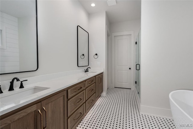 14817 Highpoint Cv, Northport, AL 35475 - bathroom featuring a soaking tub, double vanity, and a stall shower