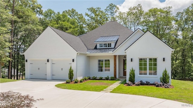 14817 Highpoint Cv, Northport, AL 35475 - modern farmhouse with a garage, concrete driveway, a front lawn, a standing seam roof, and stucco siding