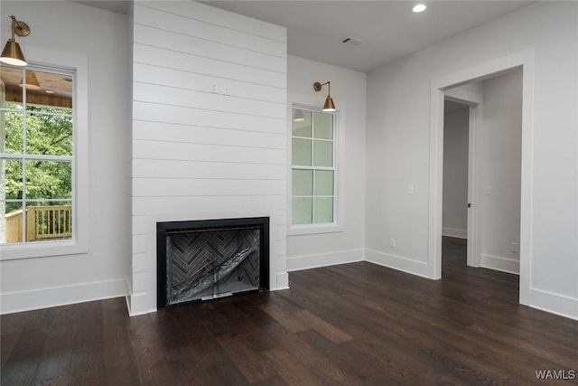 14817 Highpoint Cv, Northport, AL 35475 - unfurnished living room with dark wood-style flooring, a fireplace, and recessed lighting