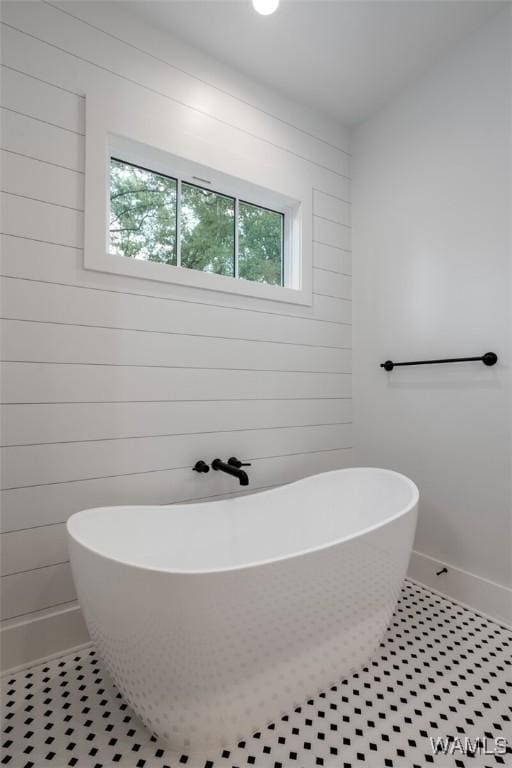 14817 Highpoint Cv, Northport, AL 35475 - full bathroom featuring a freestanding bath and wooden walls