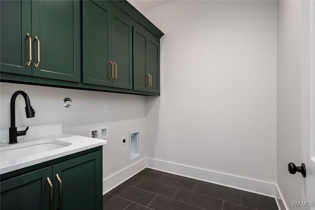 14817 Highpoint Cv, Northport, AL 35475 - washroom with cabinet space, electric dryer hookup, washer hookup, and dark tile patterned floors