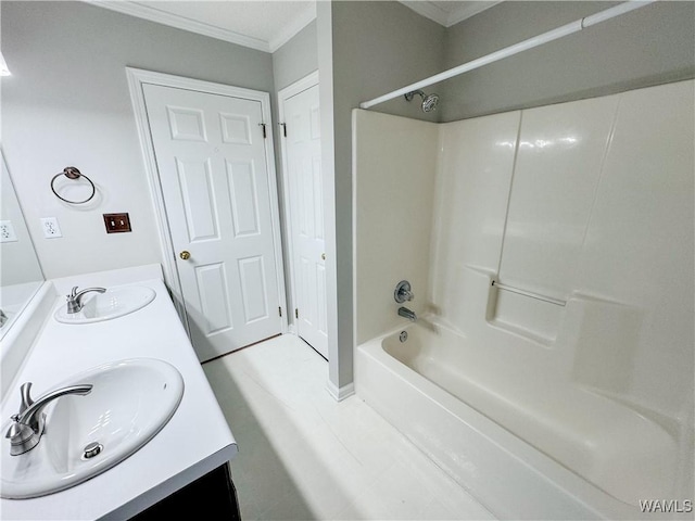 bathroom featuring vanity, crown molding, and bathing tub / shower combination