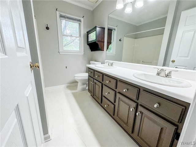 bathroom with walk in shower, tile patterned flooring, toilet, vanity, and ornamental molding