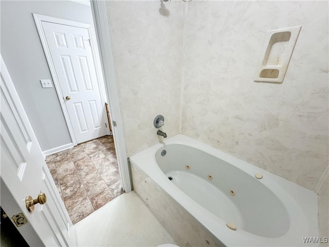 bathroom with a tub to relax in