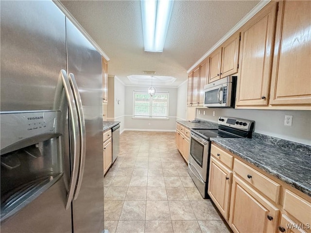 kitchen featuring stainless steel appliances, dark stone countertops, pendant lighting, light tile patterned floors, and ornamental molding