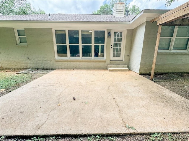 doorway to property with a patio