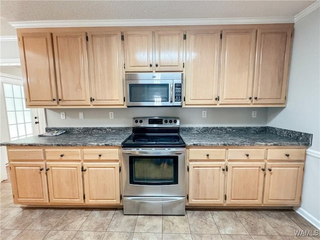 kitchen featuring light brown cabinets, light tile patterned floors, ornamental molding, and appliances with stainless steel finishes