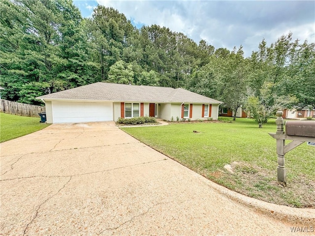 ranch-style home with a garage and a front lawn