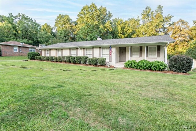 4809 Dove Creek Ave, Northport, AL 35473 - ranch-style home with a front lawn and a chimney