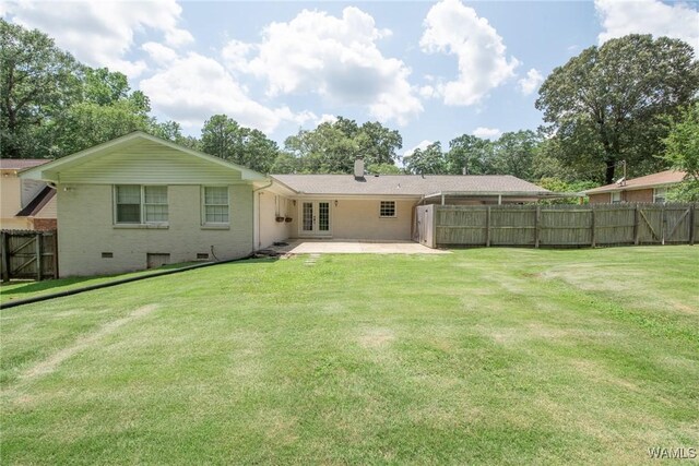 4809 Dove Creek Ave, Northport, AL 35473 - rear view of house with a patio, brick siding, a chimney, and french doors