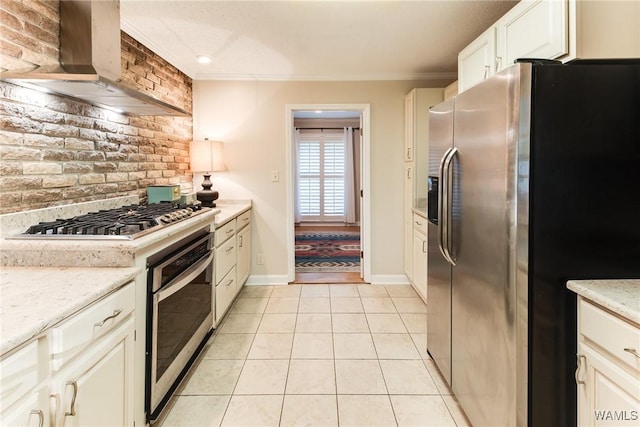 4809 Dove Creek Ave, Northport, AL 35473 - kitchen with appliances with stainless steel finishes, exhaust hood, ornamental molding, light tile patterned floors, and light stone counters