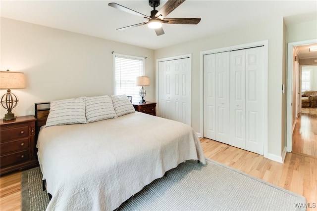 4809 Dove Creek Ave, Northport, AL 35473 - bedroom featuring light wood finished floors, multiple closets, a ceiling fan, and attic access