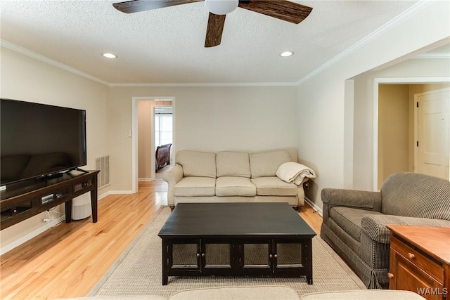 4809 Dove Creek Ave, Northport, AL 35473 - living area featuring light wood finished floors, recessed lighting, ornamental molding, and a ceiling fan