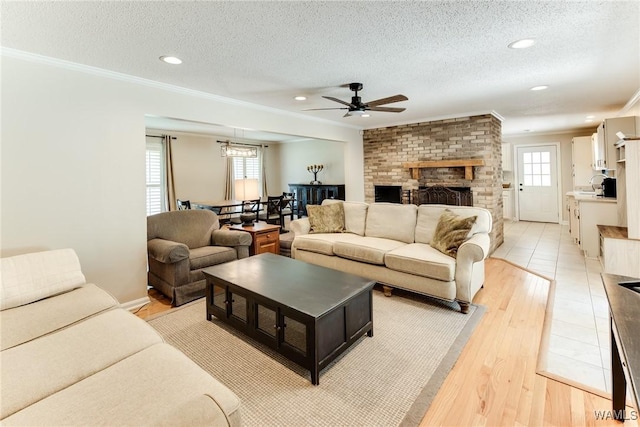 4809 Dove Creek Ave, Northport, AL 35473 - living area with a ceiling fan, plenty of natural light, crown molding, recessed lighting, and a textured ceiling
