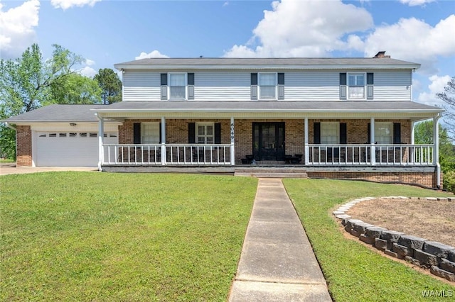 view of front of home with a porch, brick siding, a front yard, and a garage