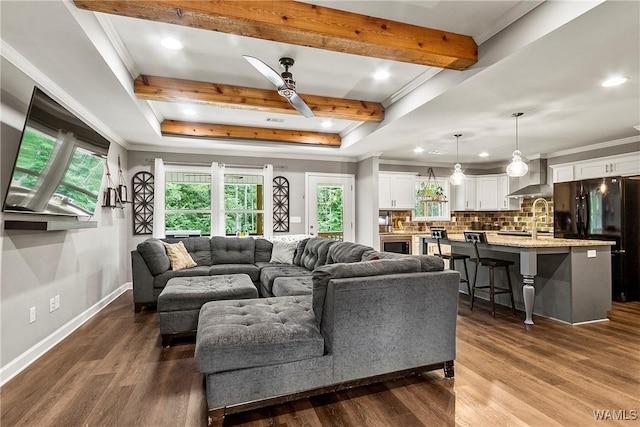 17631 Hayes Rd, Northport, AL 35475 - living room with ornamental molding, plenty of natural light, recessed lighting, beam ceiling, and dark wood finished floors